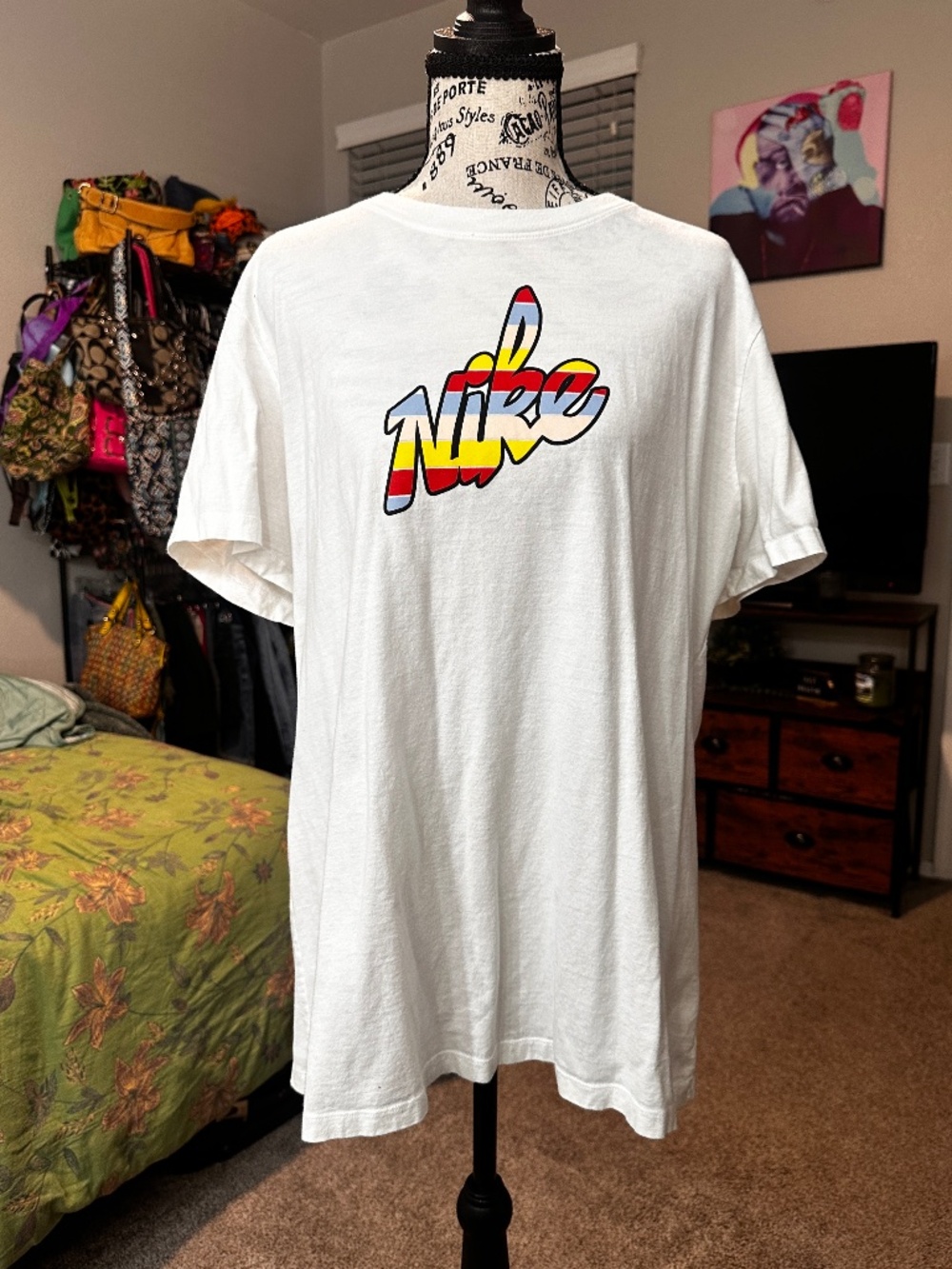 Nike white graphic tee with retro rainbow logo